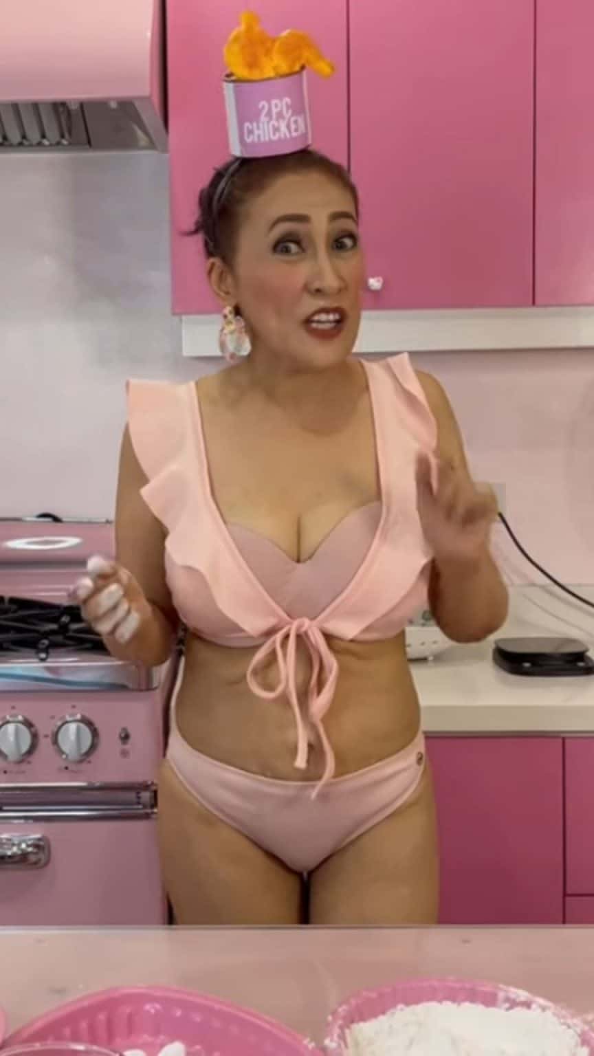 Ai-Ai delas Alas cooks chicken meal in a two-piece bikini