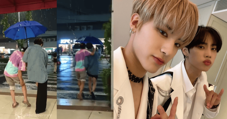 Members of The Boyz wade through Philippine floodwaters